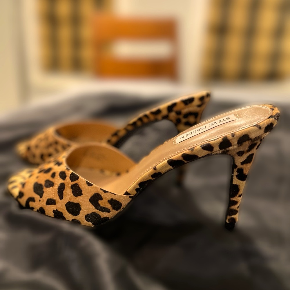 Steve Mason open toe animal print 3” heel slides.
